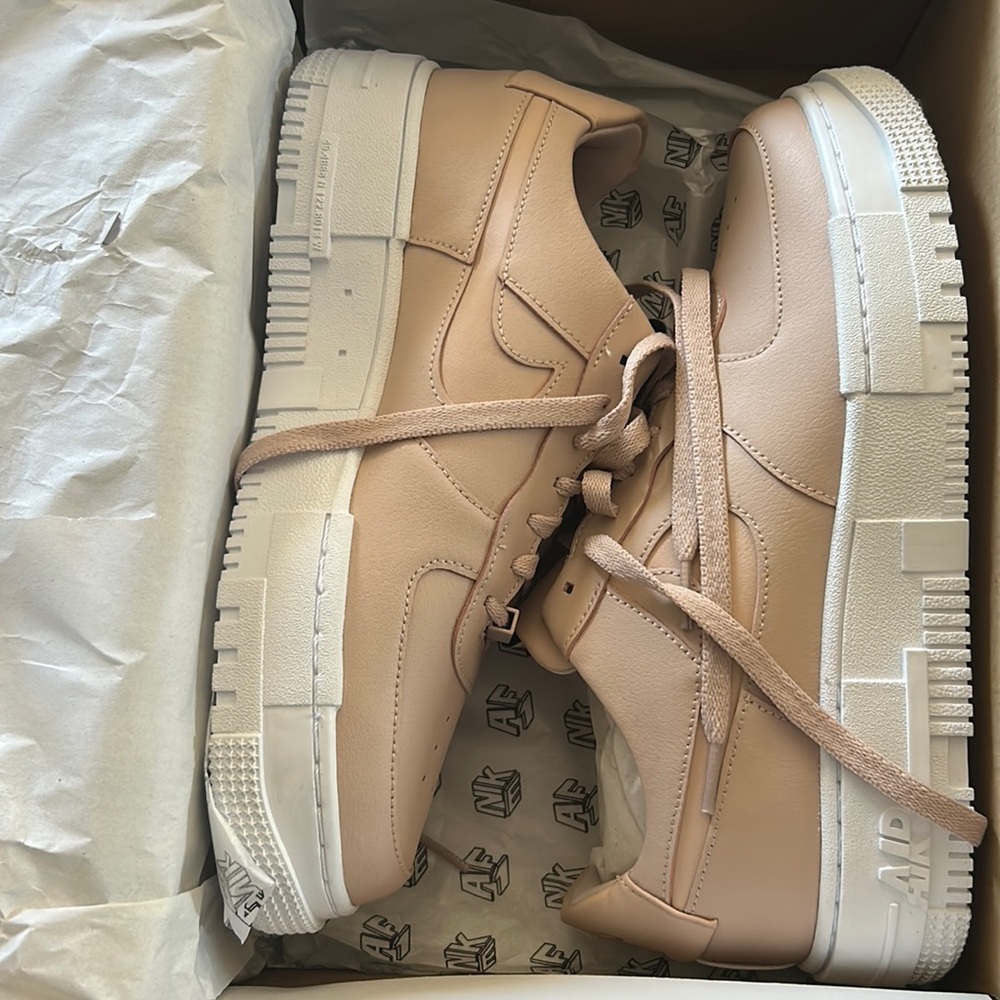 Nike Women's Low-Top Sneakers in Blush and White